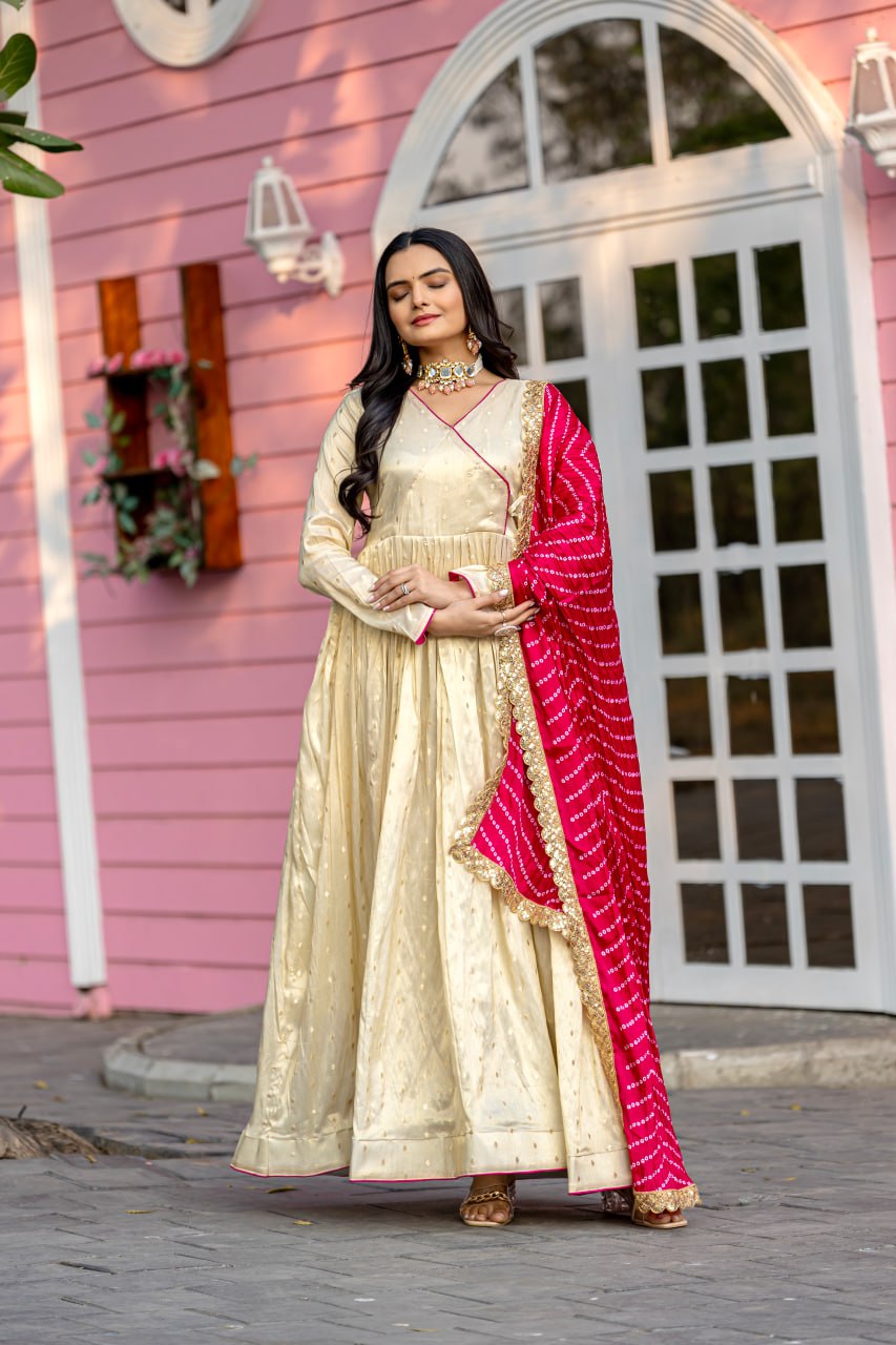 Unveil your inner star with the Celestial Elegance Gown Made from Sparkling Jequard Butti Paired with a Vibrant Digital Printed Chinon Dupatta.