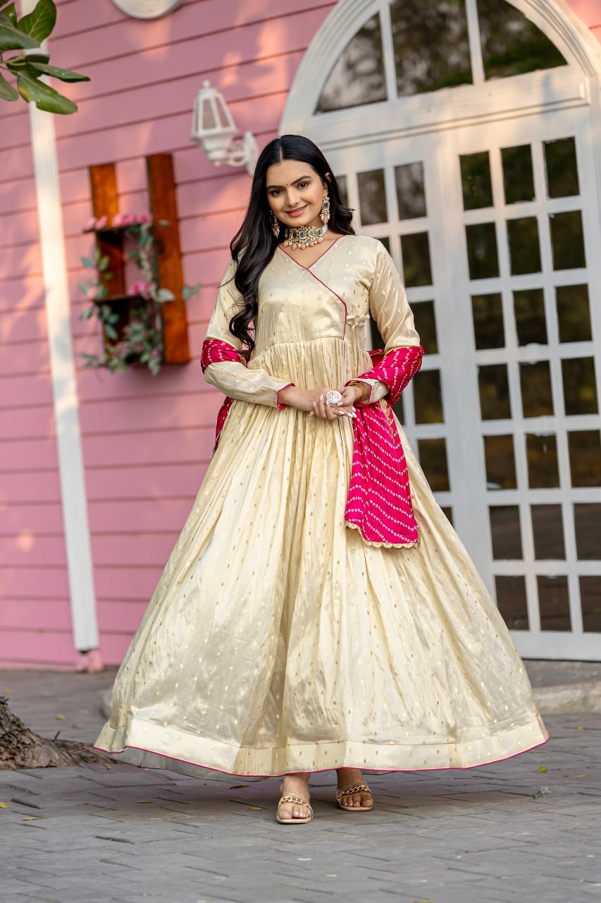 Unveil your inner star with the Celestial Elegance Gown Made from Sparkling Jequard Butti Paired with a Vibrant Digital Printed Chinon Dupatta.