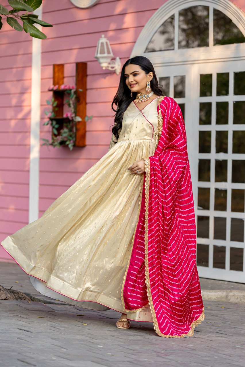 Unveil your inner star with the Celestial Elegance Gown Made from Sparkling Jequard Butti Paired with a Vibrant Digital Printed Chinon Dupatta.